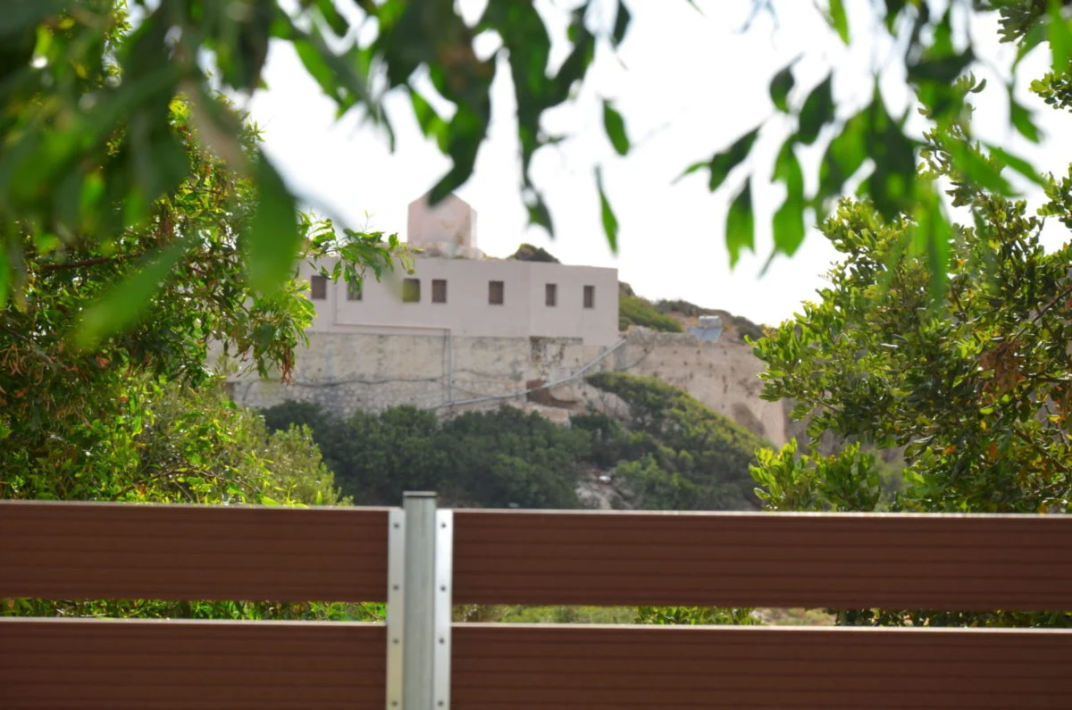 Chrysoskalitissa monastery framed olive branch view Crete
