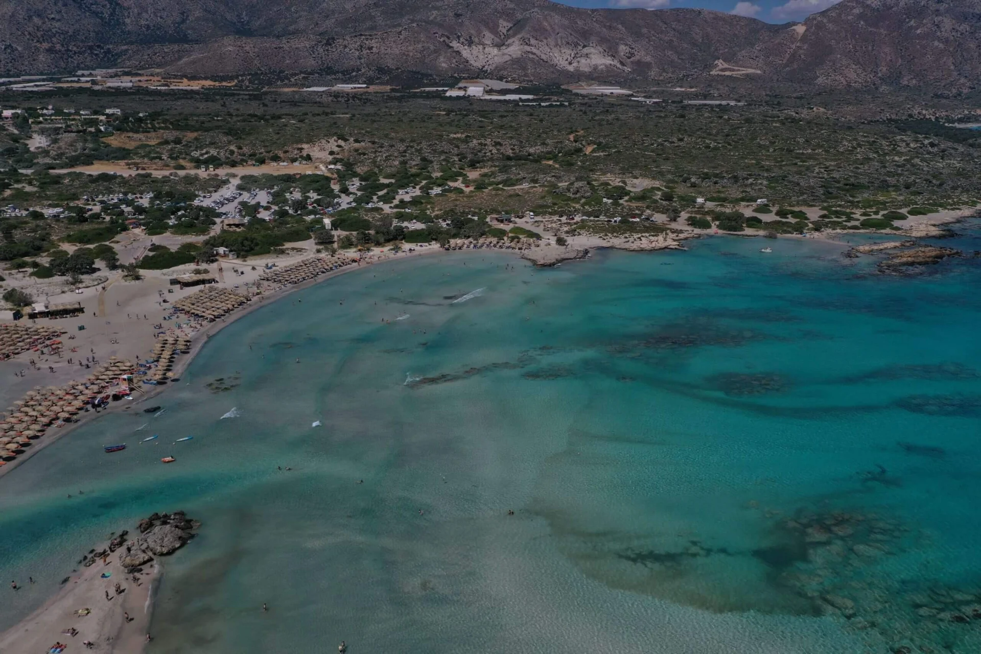 Elafonisi beach umbrellas turquoise water aerial
