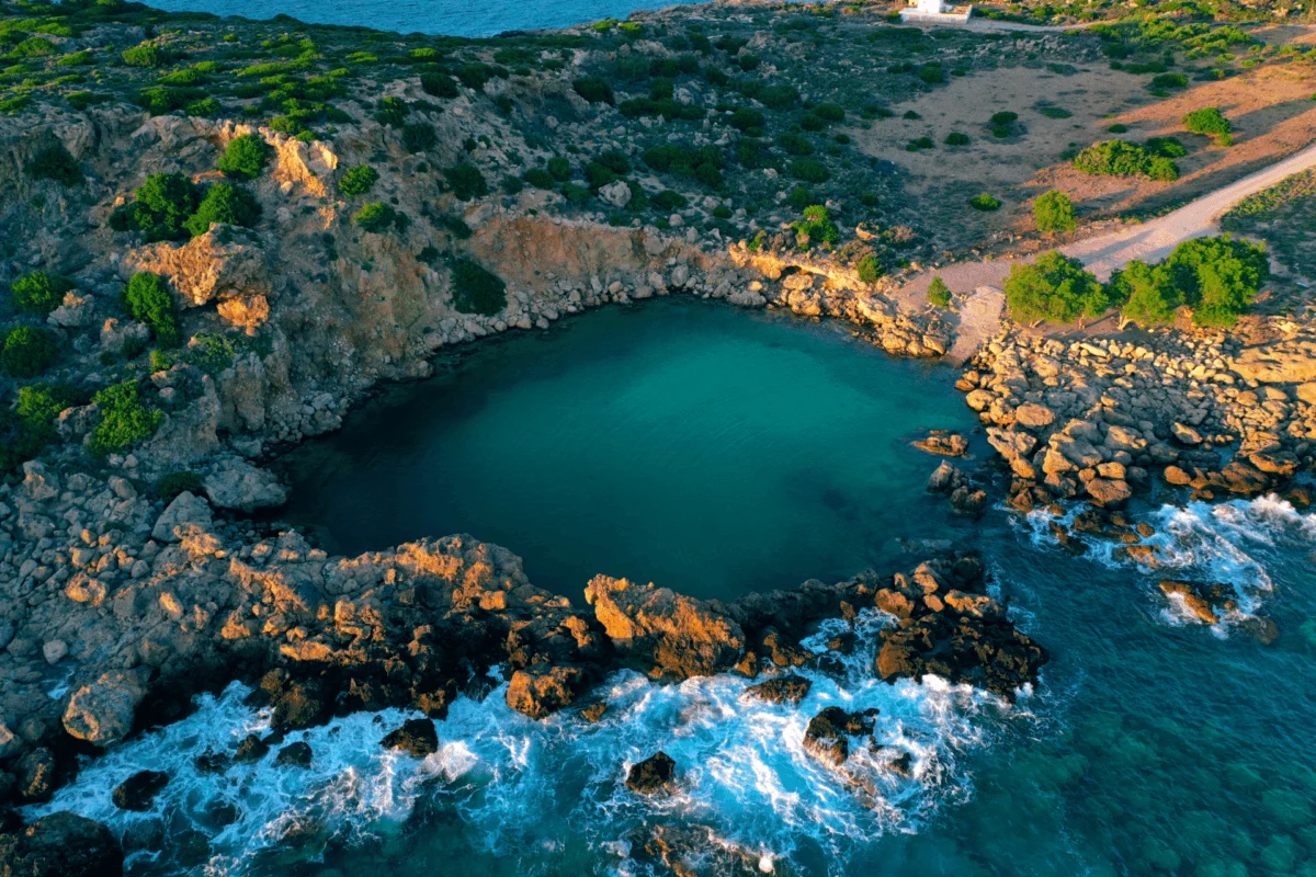 Aerial view of the natural rock pool at Voulolimni beach, Crete